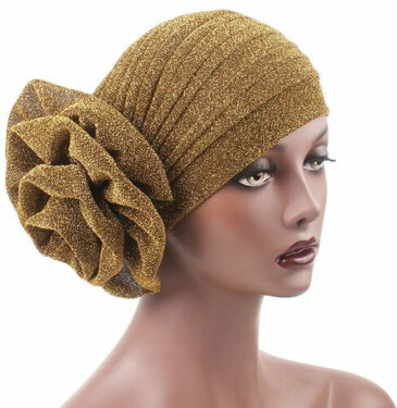 Feestelijke glitter muts met grote bloem goud kleur
